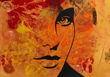 Art piece with orange golden red background, maroon leaves and part of a womans face.